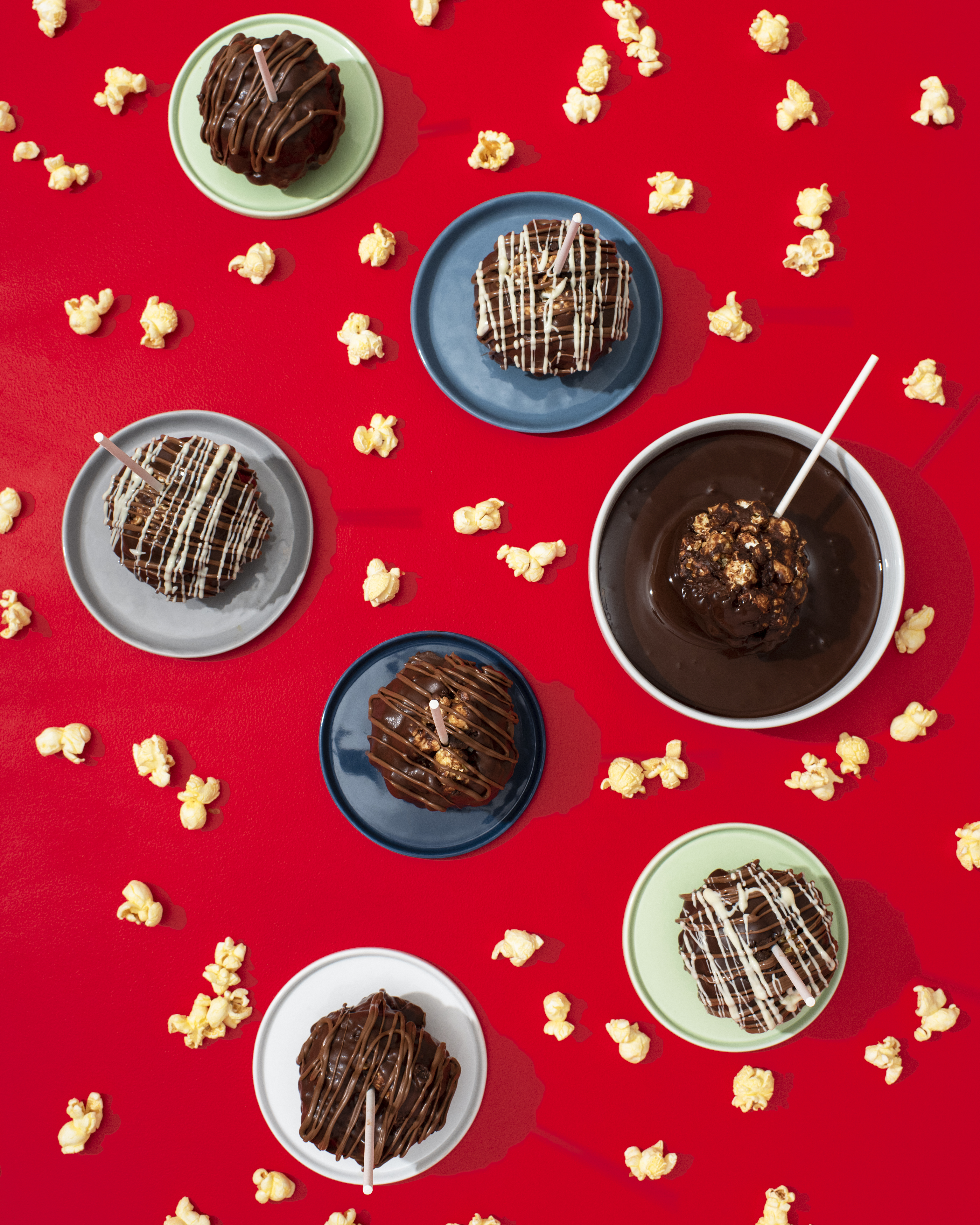 These caramel popcorn balls are studded with brownie pieces and chocolate chips, then dipped and drizzled with more chocolate. They make a great thoughtful treat for any occasion.  